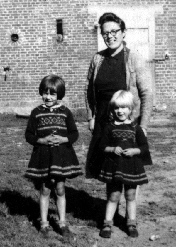 Photo of unidentified wife and children of caretaker of a chateau near Herve, Belgium used by 14th Chemical Maintenance Company, US Army, during late September and early October 1944